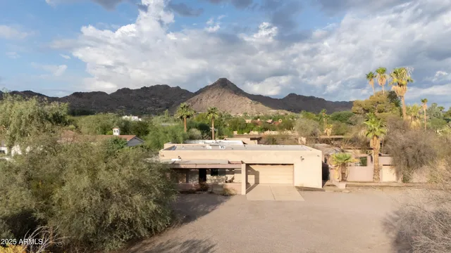 a view of a terrace with a table and chairs