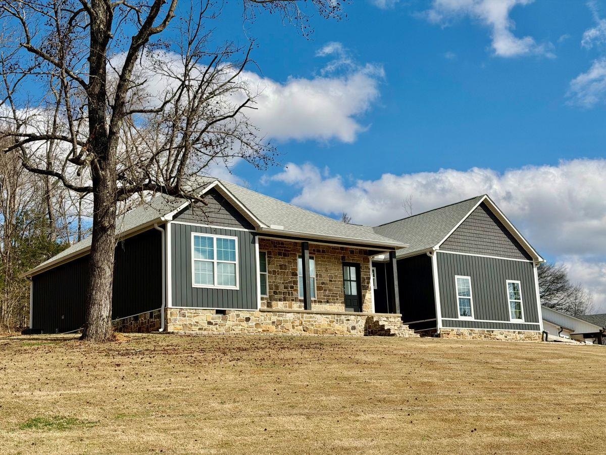 725 Crow Lane Counce, TN 38326 - Photo 1 of 19 a front view of a house with a garden