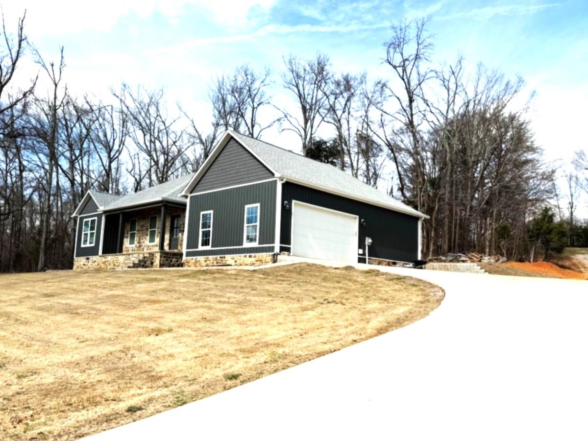 725 Crow Lane Counce, TN 38326 - Photo 2 of 19 a swimming pool with trees in front of it
