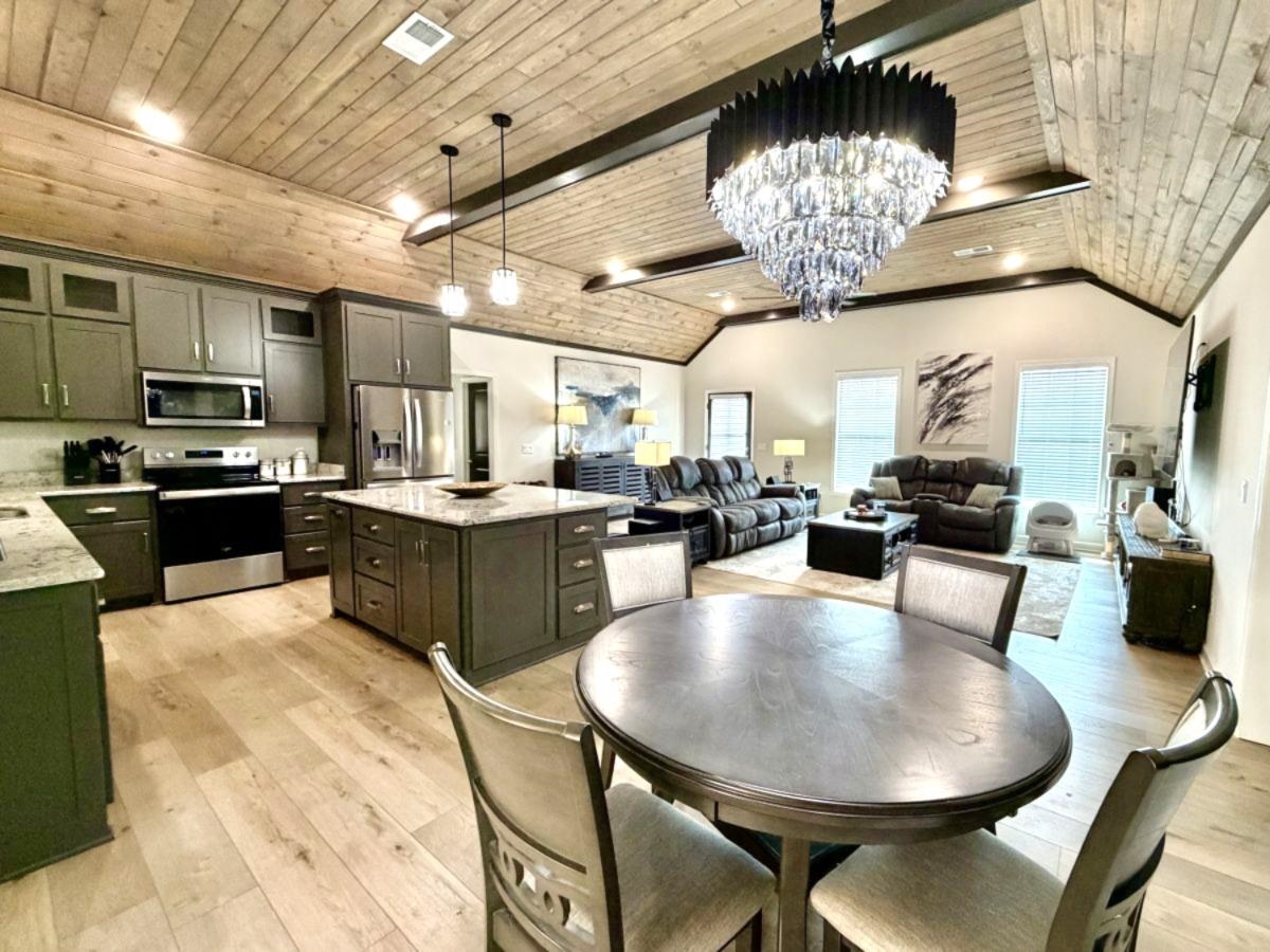 725 Crow Lane Counce, TN 38326 - Photo 19 of 19 a large kitchen with a table and chairs in it