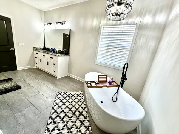 a kitchen with a sink a refrigerator and a stove