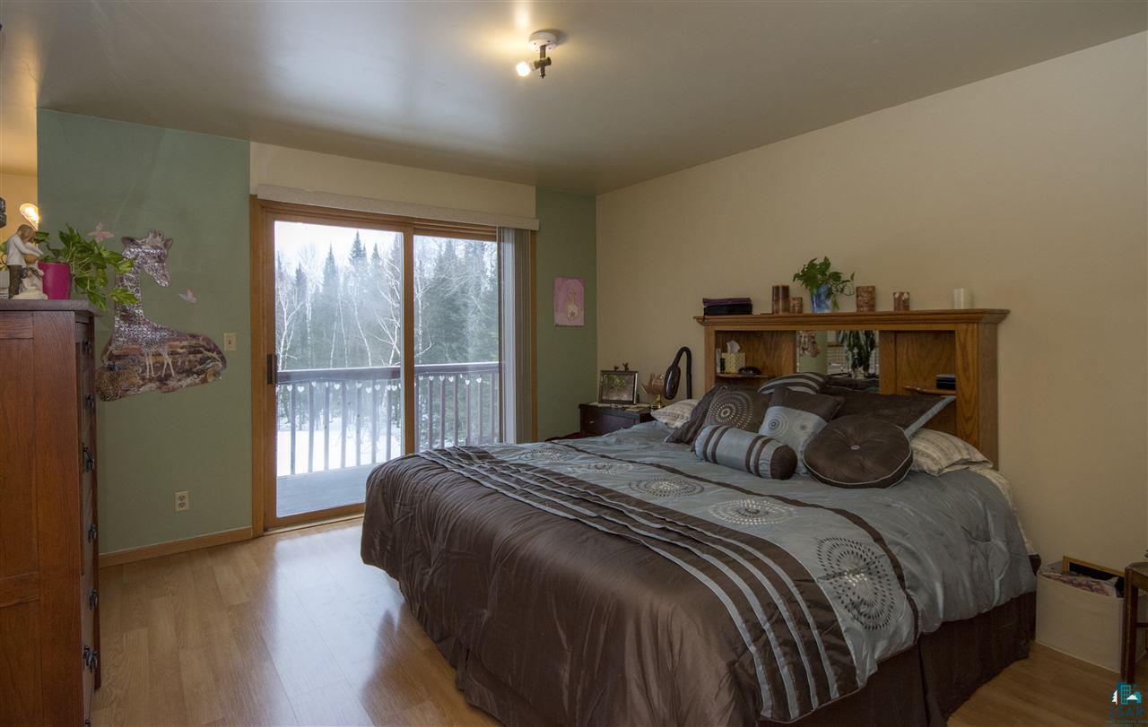 5548 McQuade Road Duluth, MN 55804 - Photo 6 of 24 Master Bedroom with Patio door to deck