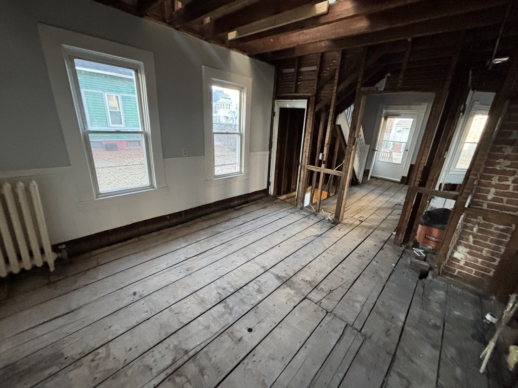 90 Cambridge Street Springfield, MA 01109 - Photo 11 of 25 a view of entryway with wooden floor and stairs