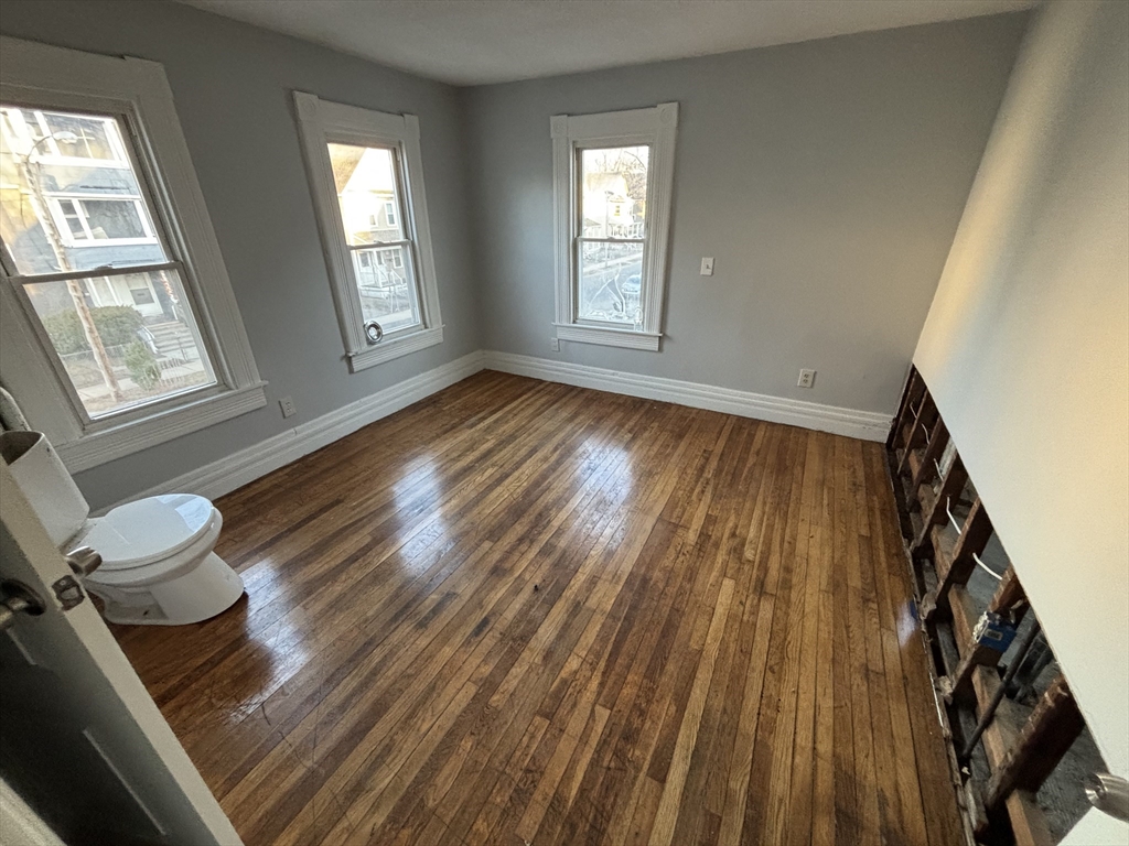 90 Cambridge Street Springfield, MA 01109 - Photo 20 of 25 a living room with hardwood floor and a window