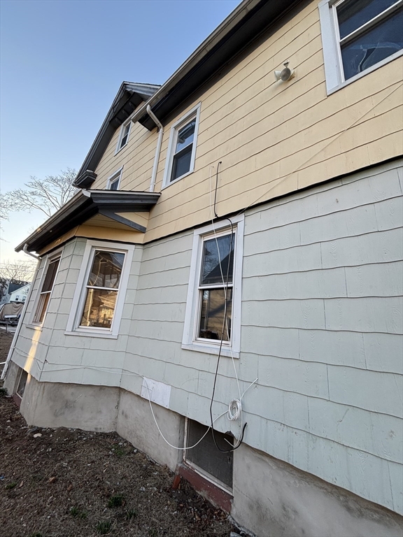 90 Cambridge Street Springfield, MA 01109 - Photo 2 of 25 a front view of a house with parking
