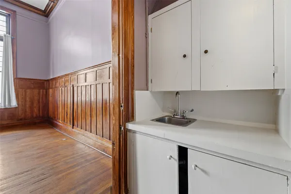 a kitchen with a sink and cabinets