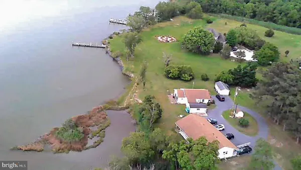 an aerial view of a house with outdoor space