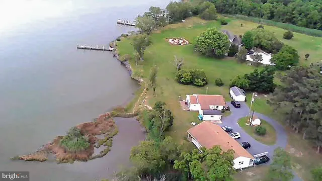 an aerial view of a house with outdoor space