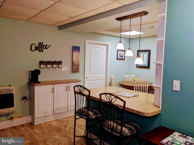 a view of a livingroom with furniture and a flat screen tv