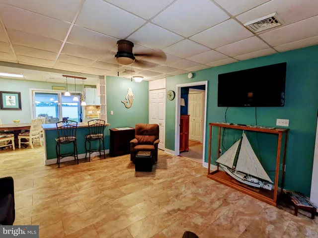 a bathroom with a toilet a sink and a mirror