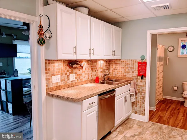 a utility room with furniture and a ceiling fan