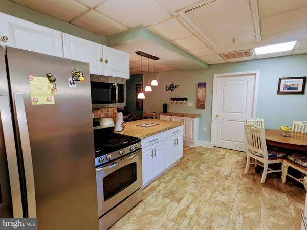 a bedroom with bed and wooden floor