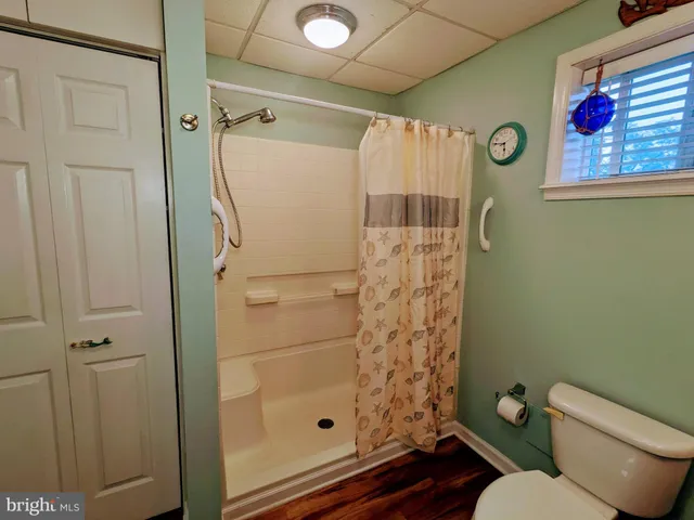 a view of living room with furniture and a flat screen tv