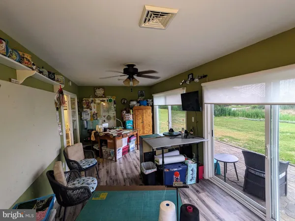 a bed room with furniture and a flat screen tv