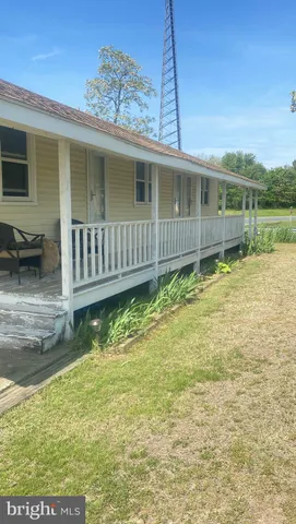 a view of kitchen with furniture and flat screen tv