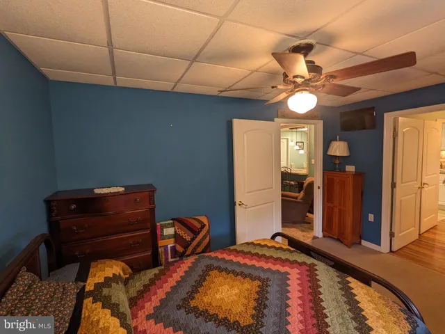 a dining room with furniture and a chandelier
