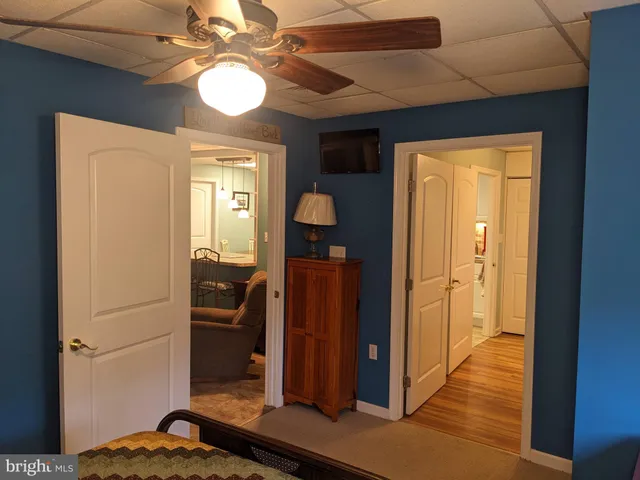 a bathroom with a sink mirror and toilet