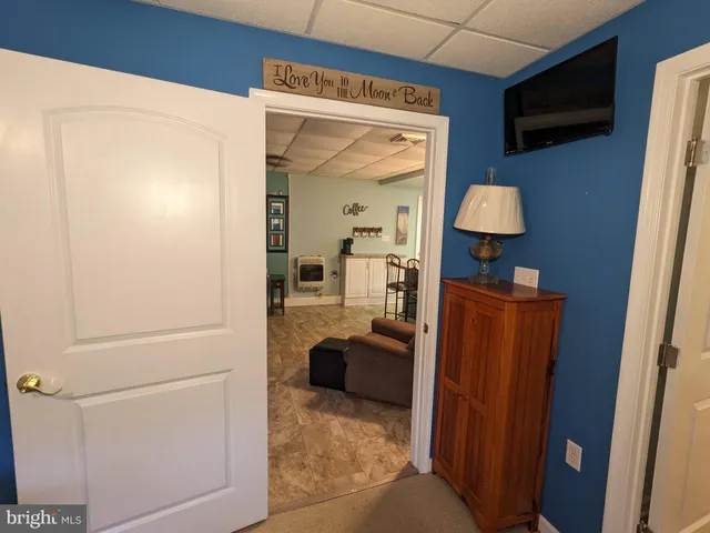 a backyard of a house with barbeque oven and plants