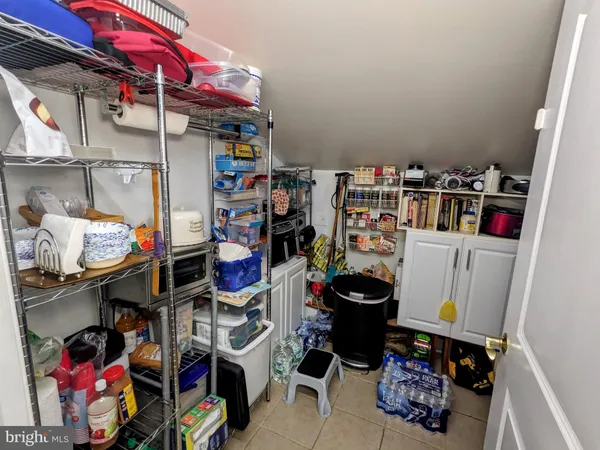 a front view of a house with a garden and yard