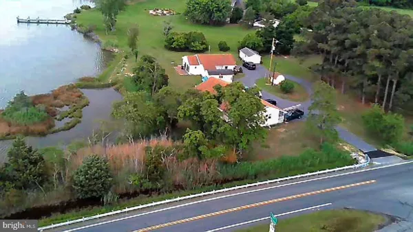 an aerial view of house with yard swimming pool and outdoor seating