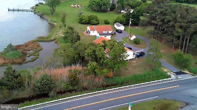 an aerial view of house with yard swimming pool and outdoor seating