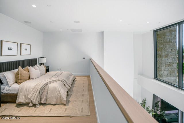 4849 North Camelback Ridge Road, Unit A107 Scottsdale, AZ 85251 - Photo 5 of 7 a bedroom with a bed and a large window