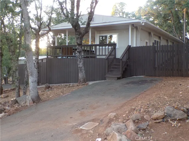 a view of a house with a snow in the yard