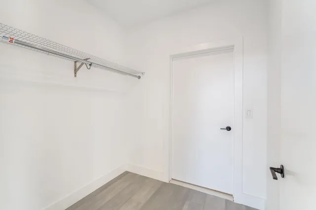 a view of a room with racks on the wall