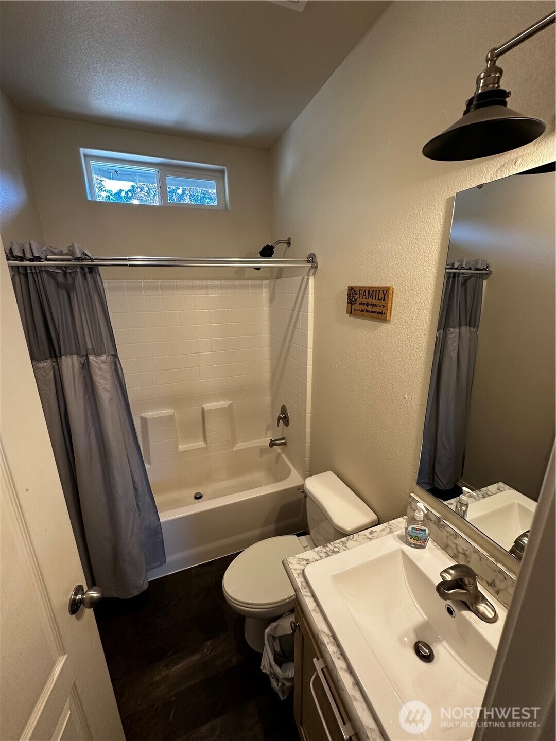 1720 Maple Lane, Unit 33 Kent, WA 98030 - Photo 16 of 20 a bathroom with a sink a toilet a mirror and shower