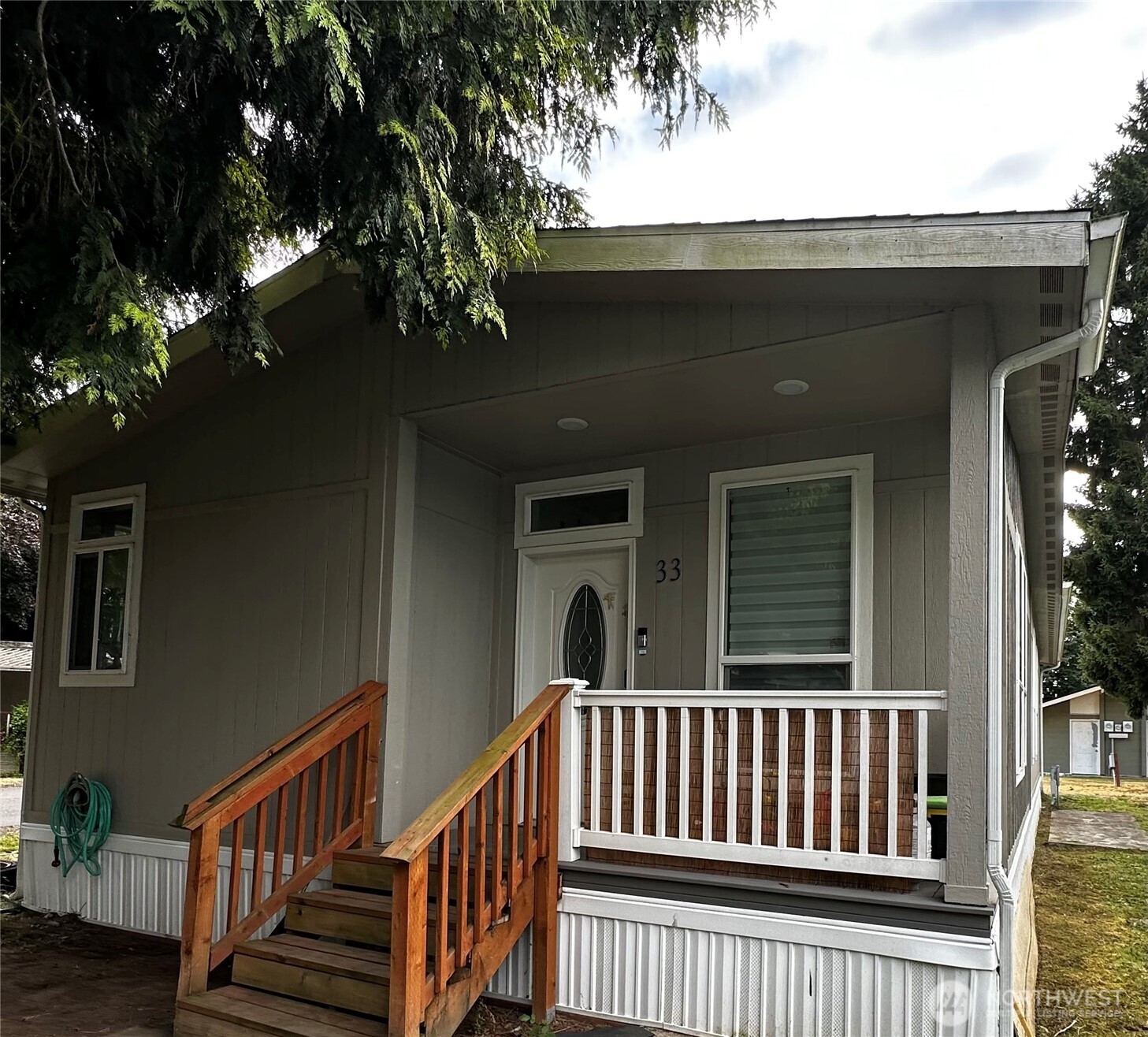 1720 Maple Lane, Unit 33 Kent, WA 98030 - Photo 2 of 20 a view of porch with a bench