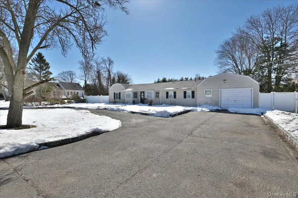a view of house with a yard
