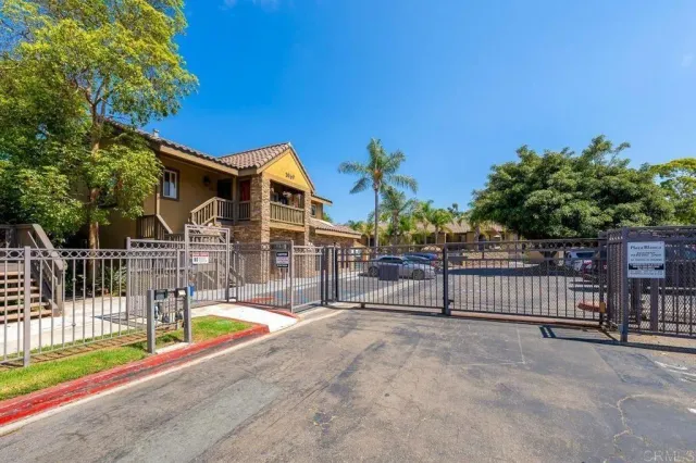 a view of a house with backyard and porch