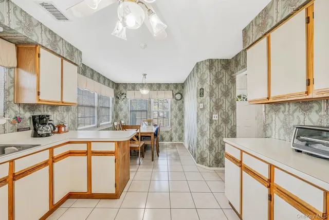 a open kitchen with stainless steel appliances granite countertop a sink and cabinets