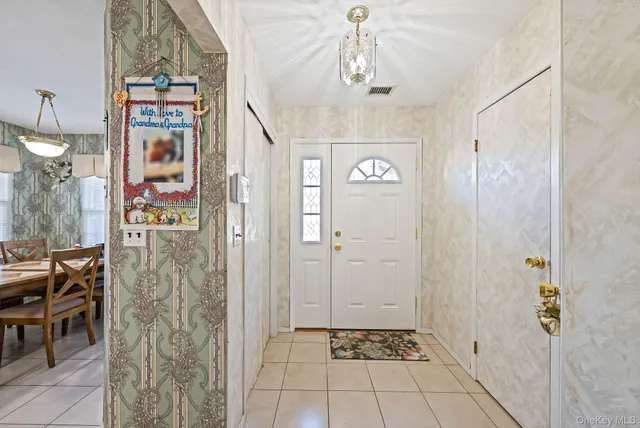 a very nice looking hallway with a carpet