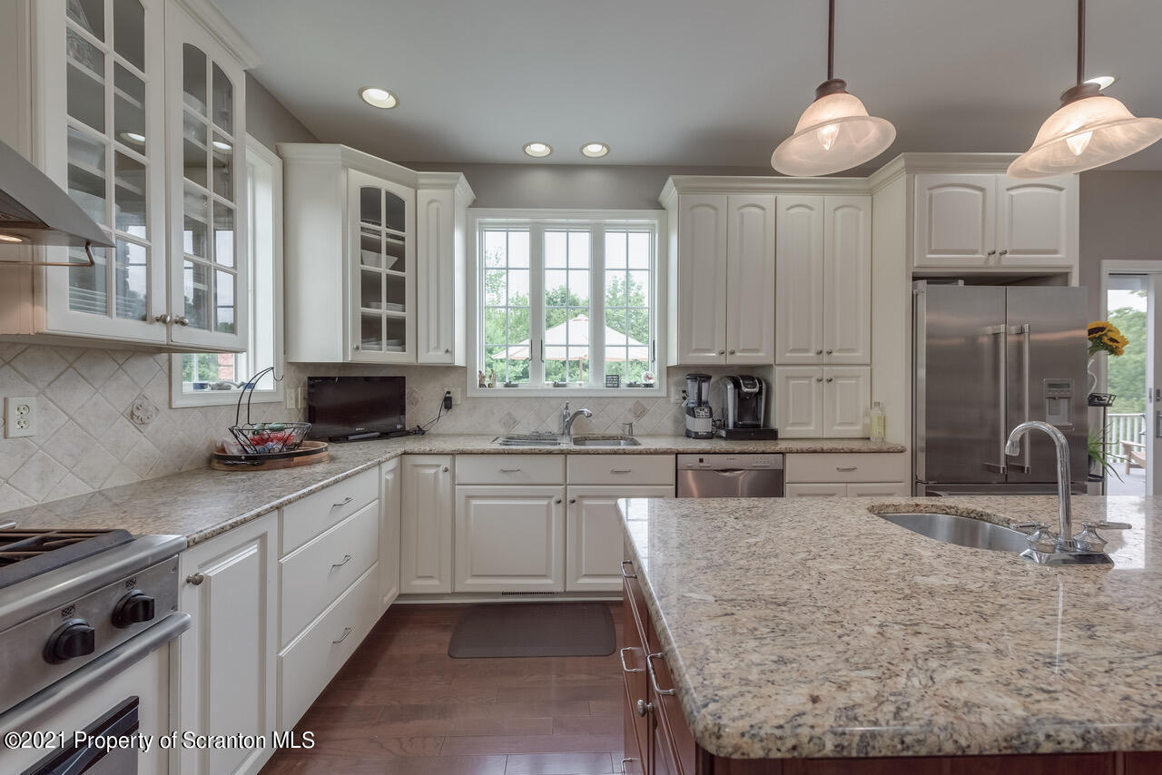 14 Kipling Drive Moosic, PA 18507 - Photo 12 of 42 a kitchen with granite countertop a sink stainless steel appliances and cabinets