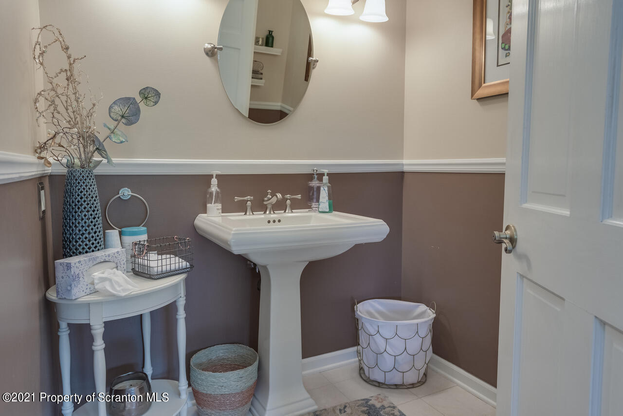14 Kipling Drive Moosic, PA 18507 - Photo 14 of 42 a bathroom with a sink mirror and toilet