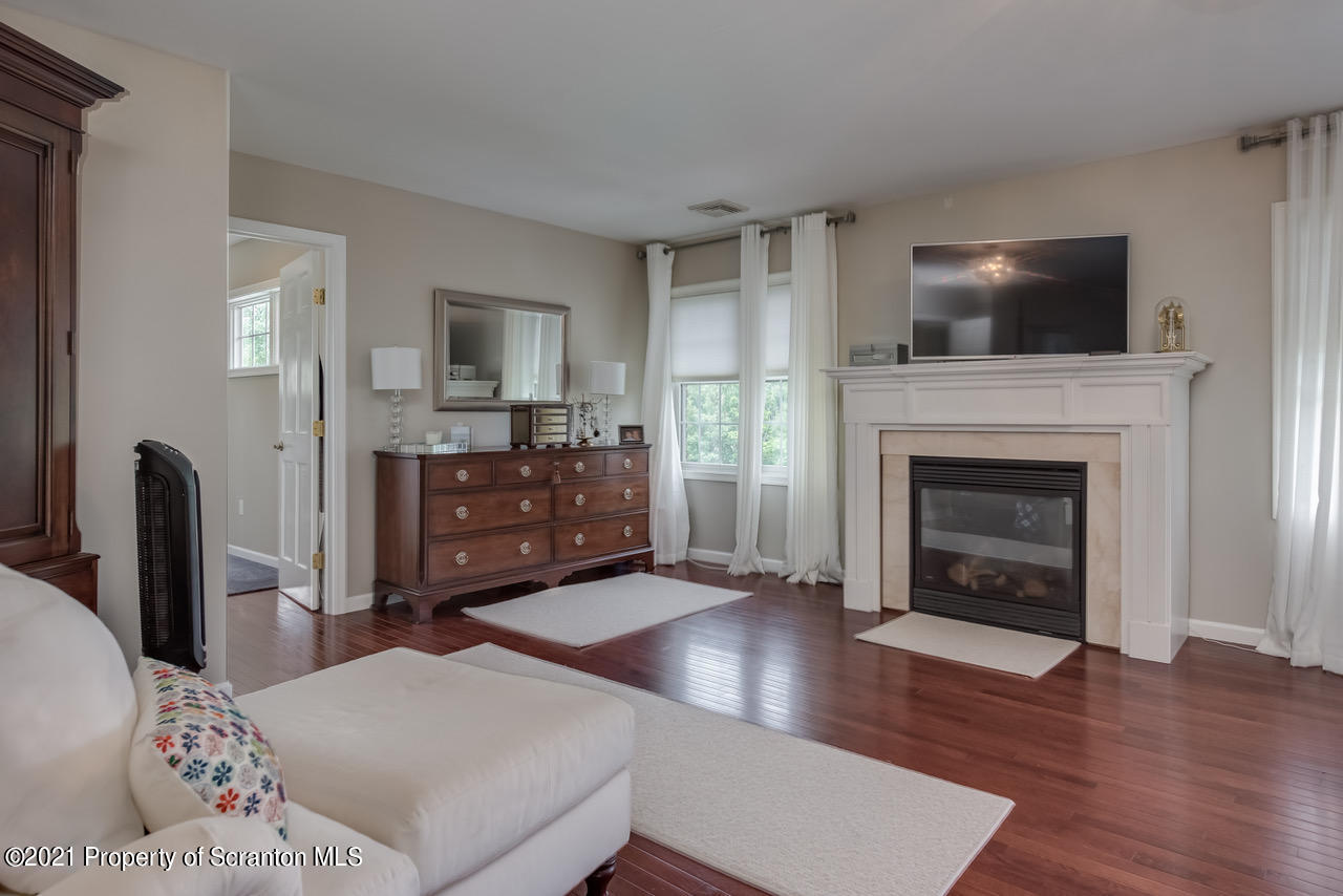 14 Kipling Drive Moosic, PA 18507 - Photo 18 of 42 a living room with furniture and a fireplace