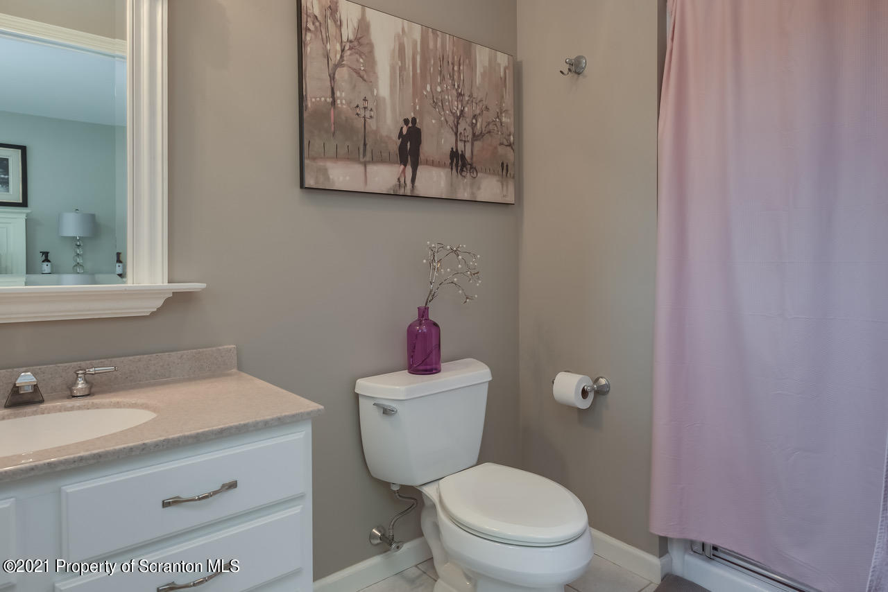 14 Kipling Drive Moosic, PA 18507 - Photo 25 of 42 a bathroom with a granite countertop toilet sink and mirror