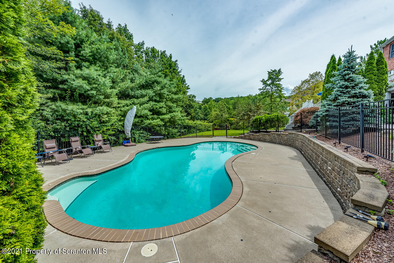 14 Kipling Drive Moosic, PA 18507 - Photo 40 of 42 a view of a swimming pool with an outdoor space and seating area