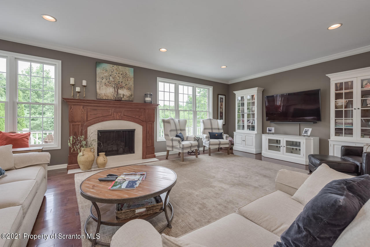 14 Kipling Drive Moosic, PA 18507 - Photo 5 of 42 a living room with furniture a fireplace and a flat screen tv
