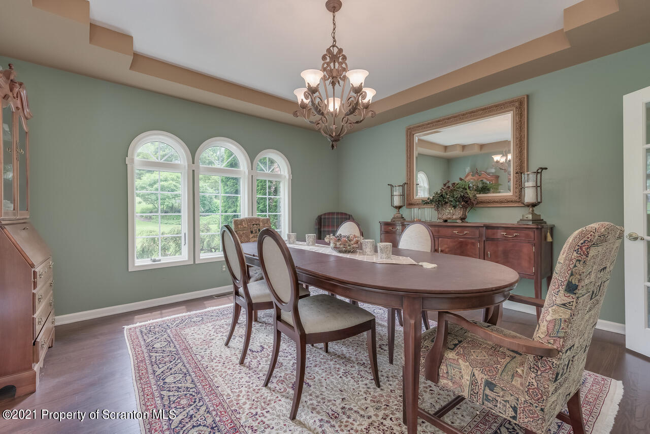 14 Kipling Drive Moosic, PA 18507 - Photo 8 of 42 a dining room with furniture a rug and a chandelier