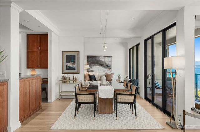 a living room with furniture a fireplace and a table