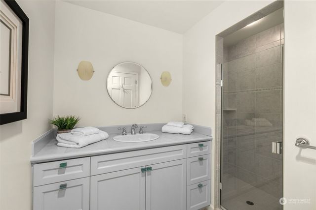 a view of a wooden bridge with ocean view