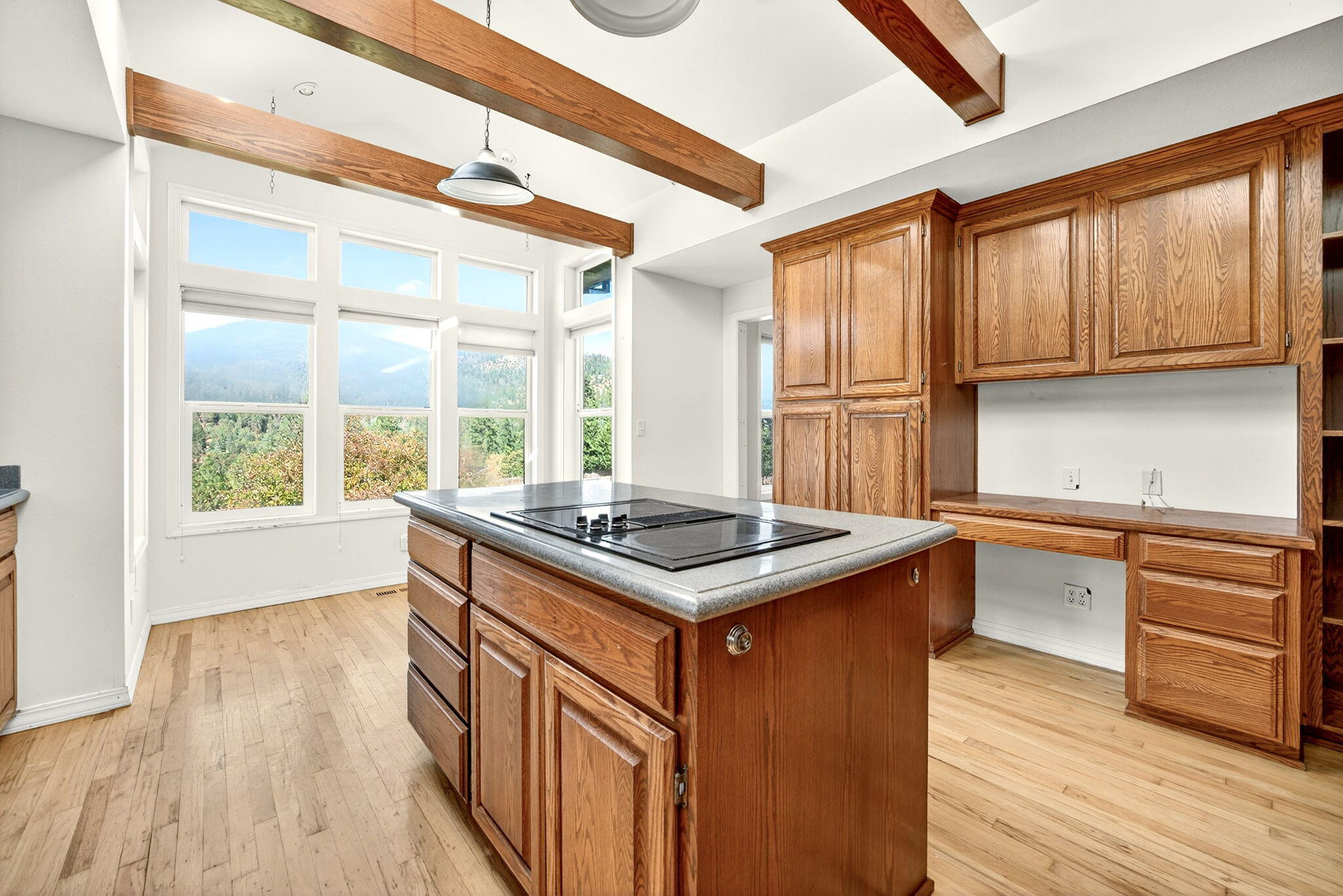 2467 Eastside Road Jacksonville, OR 97530 - Photo 60 of 85 a kitchen with granite countertop a sink and a stove top oven