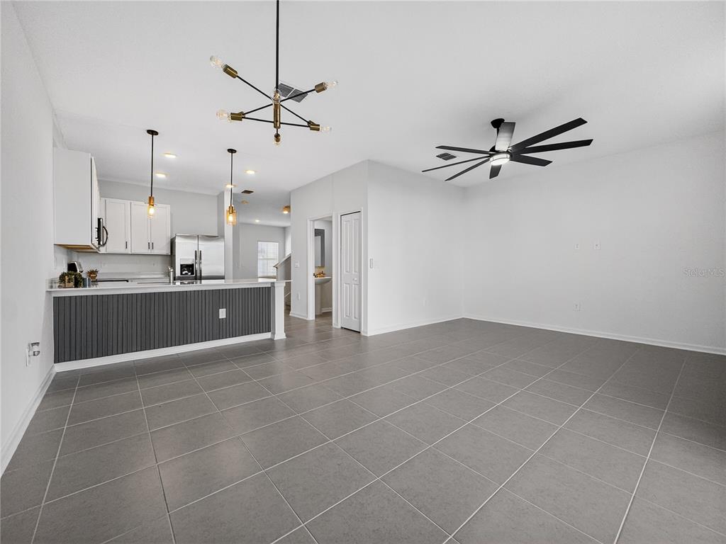 2735 Skyline Loop Kissimmee, FL 34758 - Photo 13 of 33 a view of a kitchen with a sink and a window