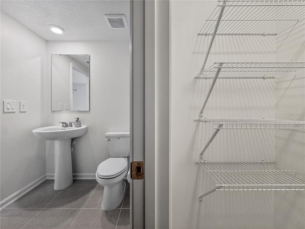 2735 Skyline Loop Kissimmee, FL 34758 - Photo 15 of 33 a bathroom with a sink toilet and shower