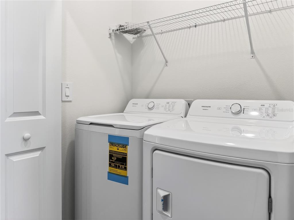 2735 Skyline Loop Kissimmee, FL 34758 - Photo 20 of 33 a utility room with dryer and washer