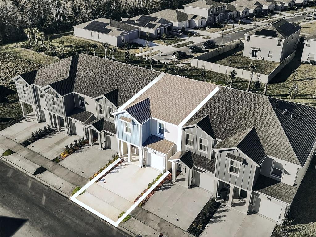 2735 Skyline Loop Kissimmee, FL 34758 - Photo 25 of 33 an aerial view of a house with swimming pool and outdoor seating