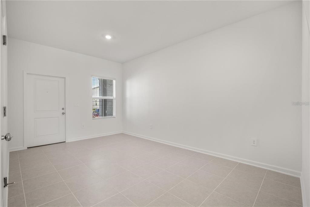 2735 Skyline Loop Kissimmee, FL 34758 - Photo 6 of 37 an empty room with windows