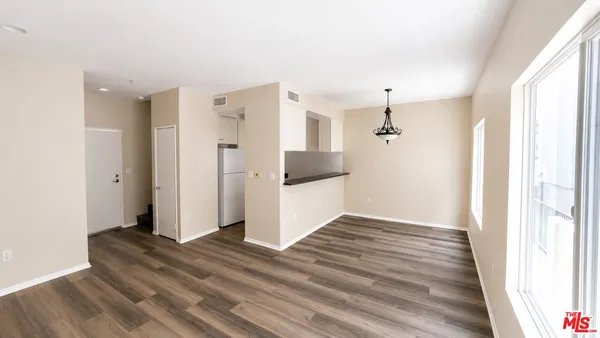 a view of a livingroom with wooden floor